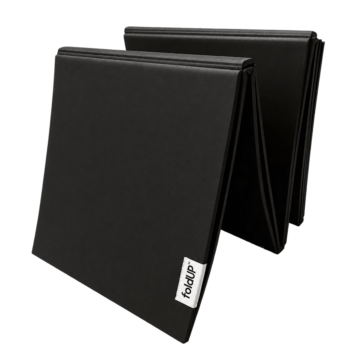 Black foldUP Movement Mat standing partially folded, showing its rectangular panels and fabric logo label.